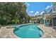 Resort-style pool with spa and lush landscaping at 13609 3Rd E Ave, Bradenton, FL 34212