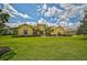 Elegant home with a large front yard and mature landscaping at 14526 17Th E Ave, Bradenton, FL 34212