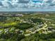 An expansive aerial view of a residential area, displaying a variety of homes and landscape at 14526 17Th E Ave, Bradenton, FL 34212