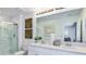 Double vanity bathroom with large mirror and shower at 3043 Novara Ln, Lakewood Ranch, FL 34211