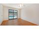 Bedroom with wood floors and view of pool at 631 Venice Ln, Sarasota, FL 34242