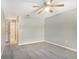 Well-lit bedroom with neutral walls and gray carpeting at 7301 Ballantrae Pl # 27D, Sarasota, FL 34238
