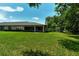 Backyard view of home with access to a patio at 7301 Ballantrae Pl # 27D, Sarasota, FL 34238