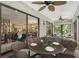 Relaxing screened porch with wicker furniture and view of the living area at 7301 Ballantrae Pl # 27D, Sarasota, FL 34238