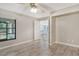 Bright bedroom with vinyl flooring and access to the living area at 7301 Ballantrae Pl # 27D, Sarasota, FL 34238