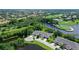 Aerial view of a house near a golf course and lake at 7301 Ballantrae Pl # 27D, Sarasota, FL 34238