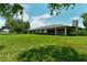 Backyard view of home with access to a patio at 7301 Ballantrae Pl # 27D, Sarasota, FL 34238
