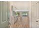 Open concept entryway showcasing kitchen and living room at 7301 Ballantrae Pl # 27D, Sarasota, FL 34238
