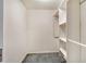 White built-in closet with shelves and hanging rods at 7301 Ballantrae Pl # 27D, Sarasota, FL 34238