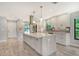 Modern kitchen with island and stainless steel appliances at 7301 Ballantrae Pl # 27D, Sarasota, FL 34238