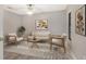 Cozy sitting area with a sofa, chairs, and a stylish rug at 7301 Ballantrae Pl # 27D, Sarasota, FL 34238
