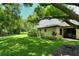 Large backyard with lush landscaping and expansive lawn at 7301 Ballantrae Pl # 27D, Sarasota, FL 34238