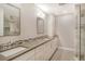 Double vanity bathroom with modern finishes and a large shower at 7301 Ballantrae Pl # 27D, Sarasota, FL 34238