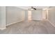 Spacious bedroom with carpet and access to bathroom at 7301 Ballantrae Pl # 27D, Sarasota, FL 34238