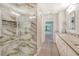 Updated bathroom with a walk-in shower, double vanity, and modern finishes at 7301 Ballantrae Pl # 27D, Sarasota, FL 34238