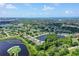 Aerial view of home nestled in a tranquil community near water and golf at 7301 Ballantrae Pl # 27D, Sarasota, FL 34238