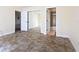 Spacious bedroom with mirrored closet doors and tile flooring at 4805 Rilma Ave # 104, Sarasota, FL 34234