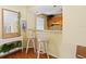Small kitchen with wood cabinets and breakfast bar at 4805 Rilma Ave # 104, Sarasota, FL 34234