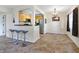 Kitchen with light wood cabinets and a breakfast bar at 4805 Rilma Ave # 104, Sarasota, FL 34234