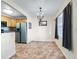 Bright dining area with tile flooring and a chandelier at 4805 Rilma Ave # 104, Sarasota, FL 34234