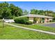 Single story home with green landscaping and driveway at 4805 Rilma Ave # 104, Sarasota, FL 34234
