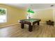 Game room featuring a billiard table and wood flooring at 4805 Rilma Ave # 104, Sarasota, FL 34234