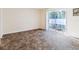 Gathering room with sliding glass doors leading to a patio at 4805 Rilma Ave # 104, Sarasota, FL 34234