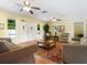 Living room with hardwood floors, two sofas, and a coffee table at 4805 Rilma Ave # 104, Sarasota, FL 34234