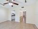 Living room with view into kitchen and hallway at 4800 Rilma Ave # 143, Sarasota, FL 34234