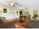 Living room with two sofas, coffee table, and hardwood floors at 4800 Rilma Ave # 143, Sarasota, FL 34234