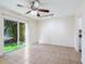 Living room with sliding glass doors and access to the kitchen at 4800 Rilma Ave # 143, Sarasota, FL 34234