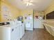 Convenient laundry room with coin-operated machines at 4800 Rilma Ave # 143, Sarasota, FL 34234