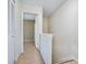 Simple hallway with beige walls and tile flooring at 4800 Rilma Ave # 143, Sarasota, FL 34234