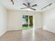 Living room with sliding glass doors leading to a patio at 4800 Rilma Ave # 143, Sarasota, FL 34234