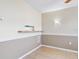 Living room with tile floor, ceiling fan, and kitchen passthrough at 4800 Rilma Ave # 143, Sarasota, FL 34234