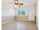 Living room with tile floor, ceiling fan, and access to patio at 4800 Rilma Ave # 143, Sarasota, FL 34234