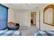 Bedroom with twin beds, a chair, and access to a bathroom at 139 Long Meadow Lane Ln, Rotonda West, FL 33947
