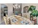 Casual dining area with table, chairs, and view into the kitchen and living areas at 139 Long Meadow Lane Ln, Rotonda West, FL 33947