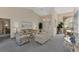 Bright living room with vaulted ceilings, comfortable seating, and access to other rooms at 139 Long Meadow Lane Ln, Rotonda West, FL 33947