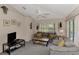 Cozy Gathering room with comfortable seating and access to a patio at 139 Long Meadow Lane Ln, Rotonda West, FL 33947