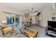 Spacious living room with pool access, comfortable furniture, and a TV at 139 Long Meadow Lane Ln, Rotonda West, FL 33947