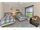Two twin beds with nautical themed bedding in a bright bedroom at 139 Long Meadow Lane Ln, Rotonda West, FL 33947
