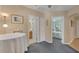 Bright hallway showcasing views of bathroom and bedroom at 839 40Th St, Sarasota, FL 34234