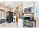 Updated kitchen, equipped with stainless steel range and microwave at 839 40Th St, Sarasota, FL 34234