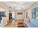 Open living room and kitchen with a blue couch and hardwood floors at 839 40Th St, Sarasota, FL 34234