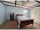 Cozy bedroom with wooden bed frame, bookcase, area rug and bright natural light at 839 40Th St, Sarasota, FL 34234