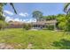 Large backyard with green grass and a patio area at 839 40Th St, Sarasota, FL 34234