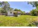 Fenced backyard with a large lawn and home at 839 40Th St, Sarasota, FL 34234