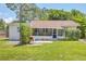 Charming home with a screened porch and a well-maintained backyard at 839 40Th St, Sarasota, FL 34234