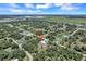 Aerial view showing a single-story house situated in a residential neighborhood at 221 Evergreen St, Punta Gorda, FL 33982